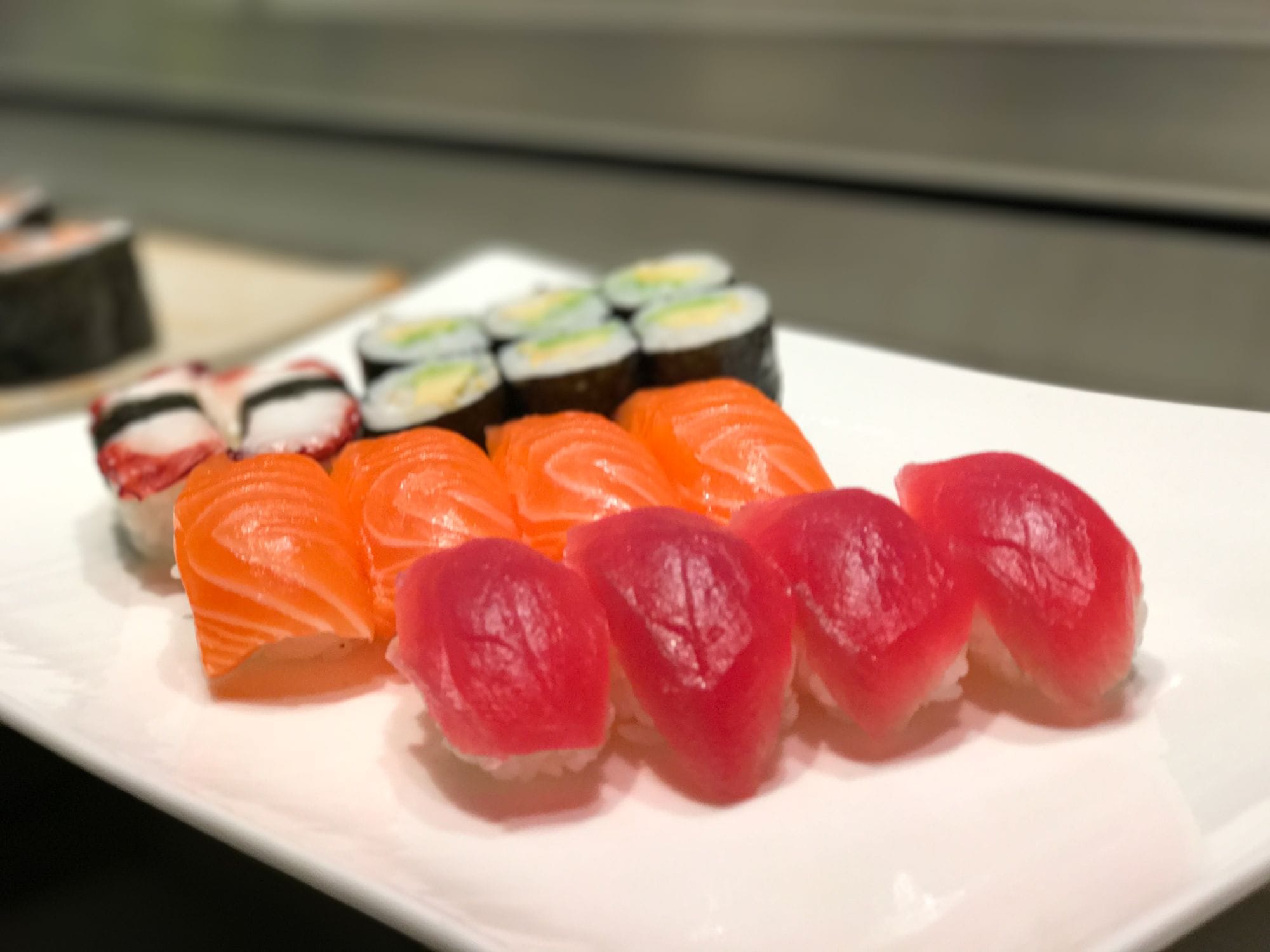 Sushi set with salmon nigiri, tuna nigiri, octopus nigiri and avocado maki at Sushi Berlin